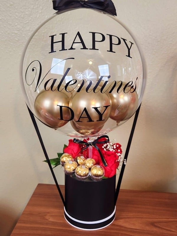 Bubble balloon gift basket with roses and chocolates in a black gift box